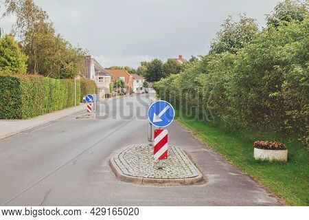 Concrete Islands On A Street In Denmark That Force Drivers To Slow Down. Focus In The Foreground