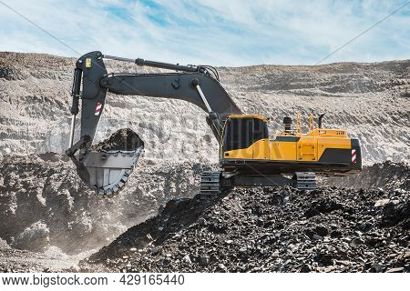 Large Quarry Dump Truck. Loading The Rock In Dumper. Loading Coal Into Body Truck. Production Useful
