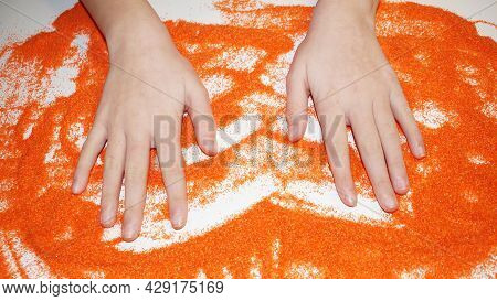 The Palms Of A Teenager On The Orange Kinetic Sand During A Sand Therapy Session, Autism Rehabilitat