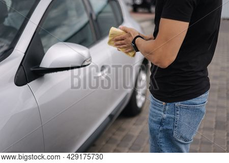 Middle Selection On Man Hold Yellow Rug For Car Cleaning