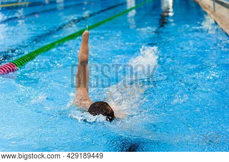 Member Of The Paralympic National Team In Distance Swimming. The Swimmer Is Disabled Without One Hor