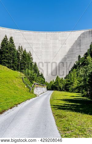 Huge Concrete Apline Dam On Sunny Summer Day. Zillergrundl Speicher, Zillertal Alps, Austria