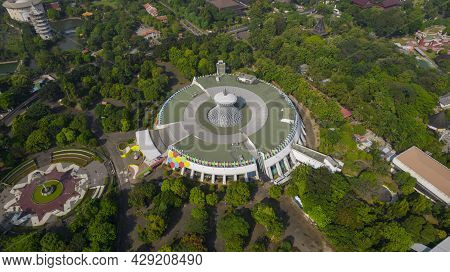 Aerial View Of Taman Mini Indonesia Indah As National Landmark In Indonesia With Noise Cloud. Jakart