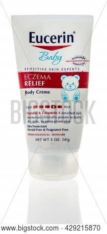 Winneconne, Wi -8 August 2021:  A Package Of Eucerin Baby Eczema Relief Body Creme On An Isolated Ba
