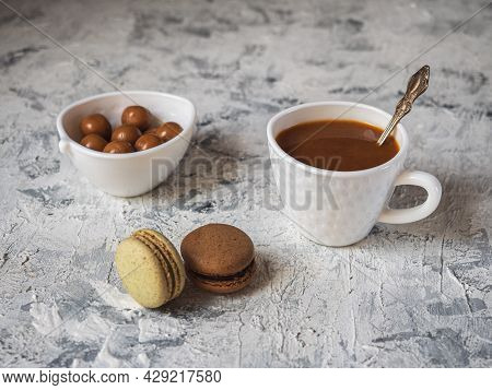 Delicious Snack With Coffee, Caramel And Cookies In A White Dish On A White Table
