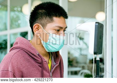 The Asian Tourist Man Has Checked Body Temperature With A Thermal Temperature Scanner Detector, New 