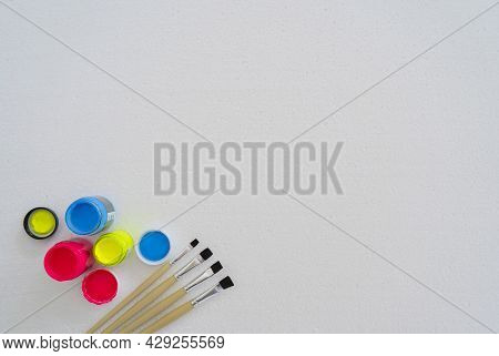 Paintbrushes And Plastic Paints Are Placed On A Foam Pad. Polystyrene ,styrofoam Foam Texture And Ba