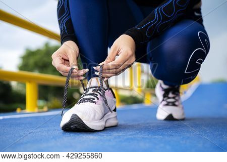 Running Shoes Runner Woman Tying Laces For Autumn Run In Forest Park. Runner Trying Running Shoes Ge