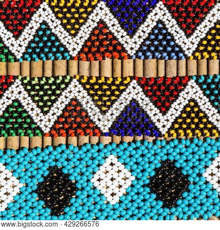 African tribal bracelets in vibrant colours. Closeup of intricate bead work for sale at a street market in South Africa.