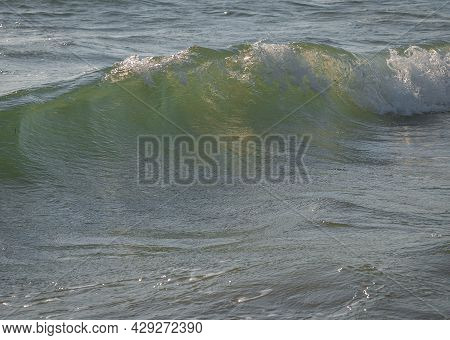 Colored Sea Waves With Splashes And White Breakers In Circeo Park, Sabaudia, Italy