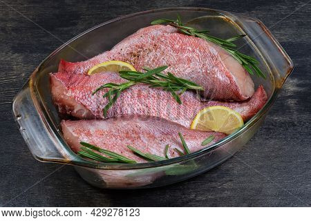 Raw Redfish Carcasses Without Heads, Also Known As Ocean Perch, Prepared With Spices For Baking In G