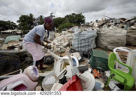 Elderly Collecting Waste For Recycling