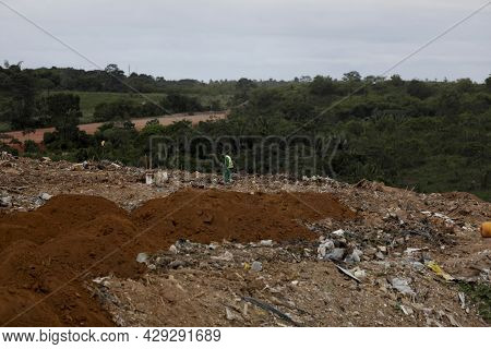 Truck Deposits Garbage In A Landfill In The City Of Salvador