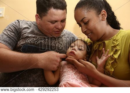 Mother With Daughter With Microcephaly