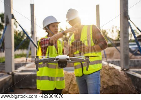 Selective Focus, Team Survey Use Drone For Aerial View Structure Inspection In Construction Site. Te