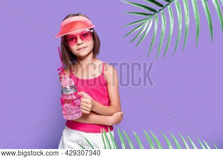 A Little Girl In White Shorts, A Pink T-shirt, Pink Trendy Glasses, With A Drink In Hand And A Summe