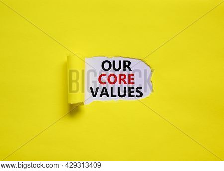 Our Core Values Symbol. Words 'our Core Values' Appearing Behind Torn Yellow Paper. Beautiful Yellow