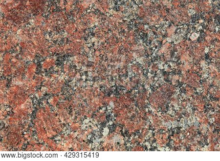 Red Granite Texture. A Variegated, Spotted Background Of Red (brown) Granite. The Stone Granite Surf