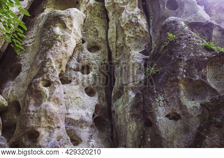 Entrance To The Limestone Cave In The Form Of A Vulva. Natural Nature Photo.