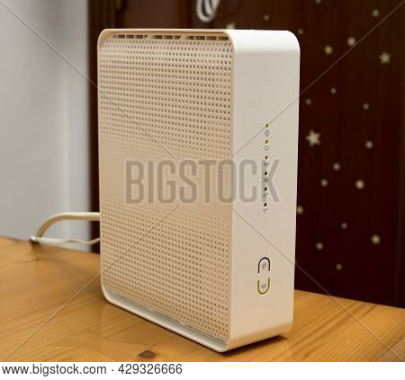 White Ruter For Internet Access, Is Placed On A Wooden Table