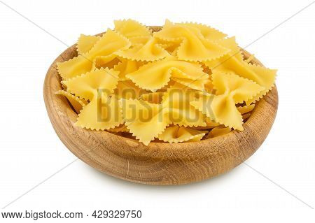 Bow Tie Pasta In Wooden Bowl Isolated On White Background With Clipping Path And Full Depth Of Field