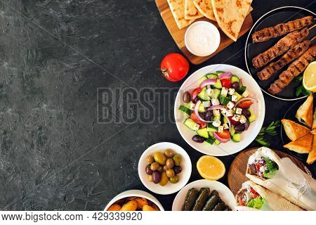 Greek Food Side Border, Top View On A Dark Background. Souvlaki, Gyros Wraps, Salad, Spanakopita, Do