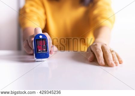 Patient Woman Using Fingertip Pulse Oximeter Oxygen Saturation Meter Spo2 Pr Blood Monitor Finger At