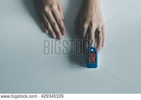 Patient Women Using Fingertip Pulse Oximeter Oxygen Saturation Meter Spo2 Pr Blood Monitor Finger On