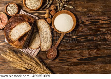 Fresh Homemade Rustic Wholegrain Bread. Homemade Bread With Sunflower Seeds On The Kitchen Table. Tr