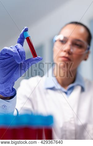 Specialist Woman Doctor Looking At Clinical Vacutainer Dna Blood Analyzing Biology Expertise. Chemis