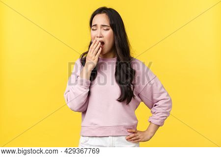 Lifestyle, Emotions And Advertisement Concept. Tired Asian Female Employee Wants Sleep, Feeling Exha