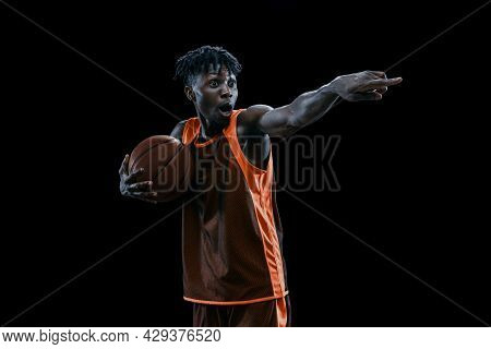 Tudio Shot Of One Professional African Basketball Player Posing With Ball Isolated Over Dark Studio 
