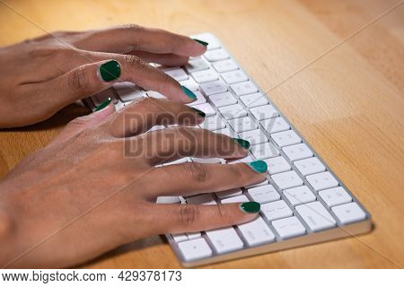 Woman Hands Typing On A Computer Keyboard. Female Hands Writing On A Aluminum Computer Keyboard. Fin
