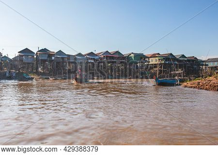 Kampong Phluk Floating Village On Tonle Sap Lake Near Siem Reap, Cambodia During Sunset. The Stilt H