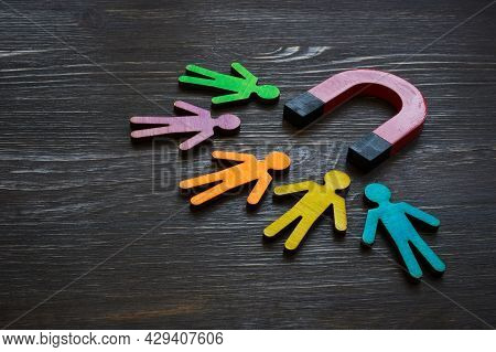 Magnet And Figures Of People. Customer Acquisition And Retention.