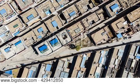 City Of Xigaze At Tibet From The Sky. Aerial View Over A Small Tibetan Village In The Mountain Of Th