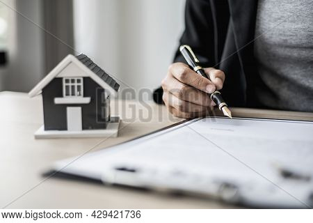 The Salesperson Is Checking The Contract Before Making An Appointment For The Customer To Join The C