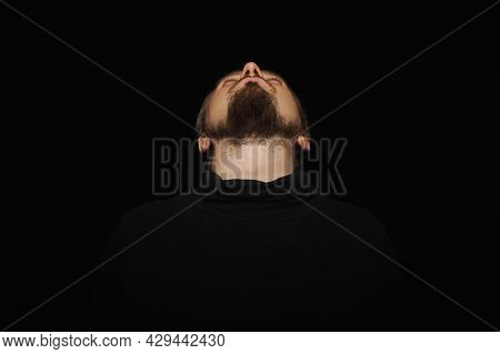 Cute Bearded Man, Threw Head Back, Black Background. Young Guy In Black Polo Neck Sweater. Confident
