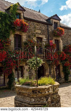 Water Well In The Square Of The Medieval Village Of Rochefort-en-terre, Morbihan Department In The B