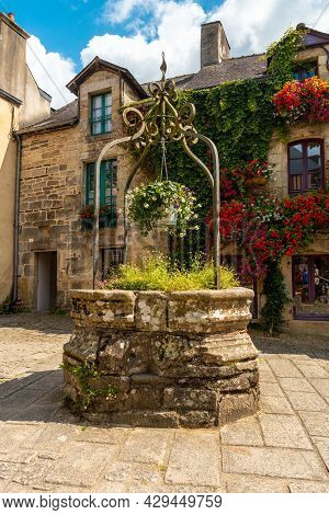 Water Well In The Square Of The Medieval Village Of Rochefort-en-terre, Morbihan Department In The B