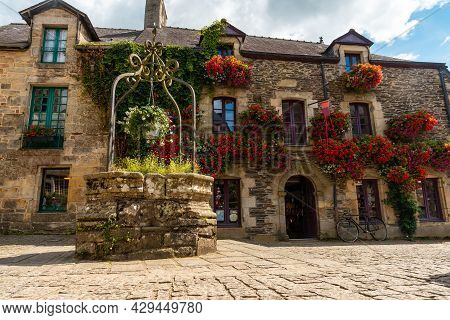 Water Well In The Square Of The Medieval Village Of Rochefort-en-terre, Morbihan Department In The B