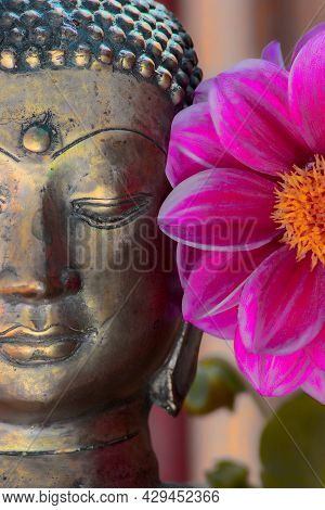 Buddha Face And Flower. Spiritual Meditation And Zen Buddhism Nature Image. Close Up Of A Gold Seren