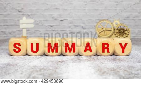 Summary Word From Wooden Blocks On Desk.