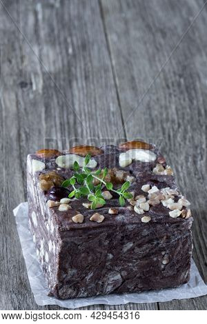 Handmade  Chocolate Sherbet With Nuts Isolated On Rustic Wooden Table