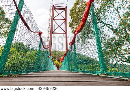 Suspension Bridge Over A Small Valley Near The Sak Dato Temple And Broga Hill. Tourist Attraction No