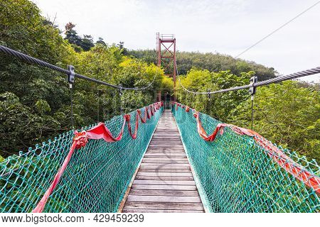 Suspension Bridge Over A Small Valley Near The Sak Dato Temple And Broga Hill. Tourist Attraction No