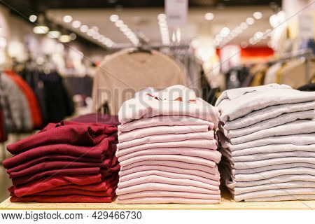 Stack Of Colorful T-shirts. Layers Of Multi-colored Fabric. Stack Of Colorful Folded Clothes, Multic