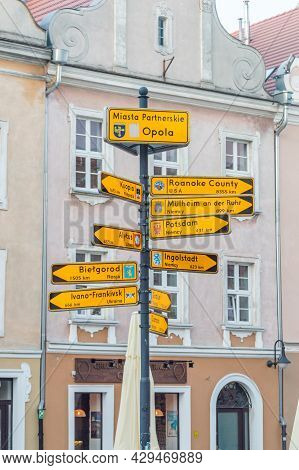 Opole, Poland - June 4, 2021: Direction With Twinned Cities With Opole Showing Directions And Distan