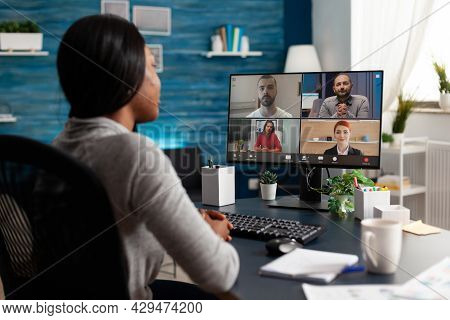 African American Woman Discussing With University Team Planning Marketing Course Ideas During Online