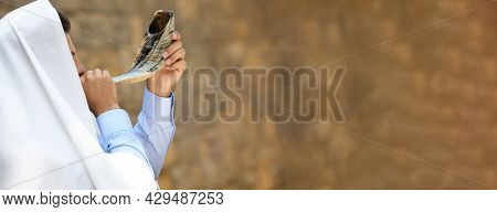 Jewish Man In Tallit Blowing Shofar Outdoors, Banner Design. Rosh Hashanah Celebration